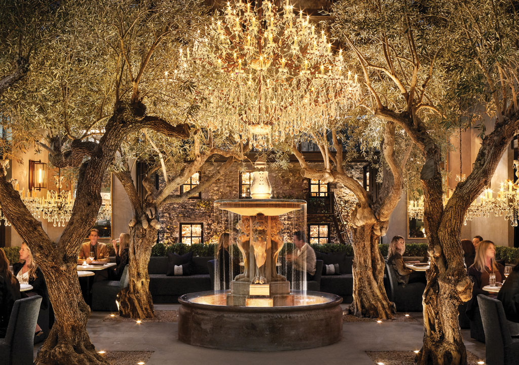 RH Yountville restaurant with trees and chandelier and fountain