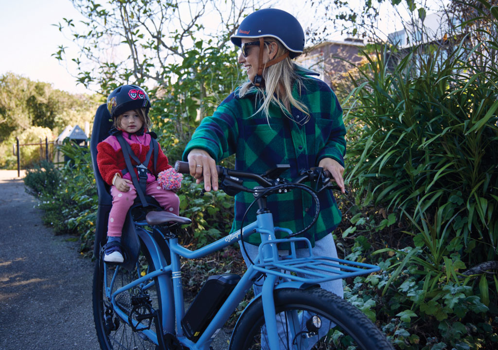 mother and daughter out for a ride on a breaking away bicycle