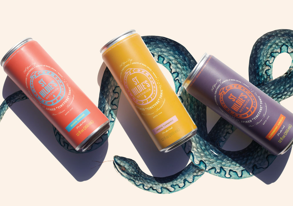 St. Hildie's spiked seltzer cans on top of a snake illustration
