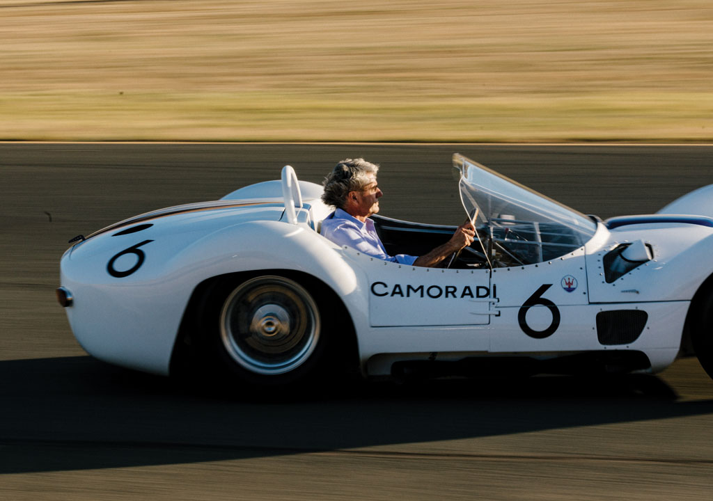 Jeff O'Neill drives white vintage racecar