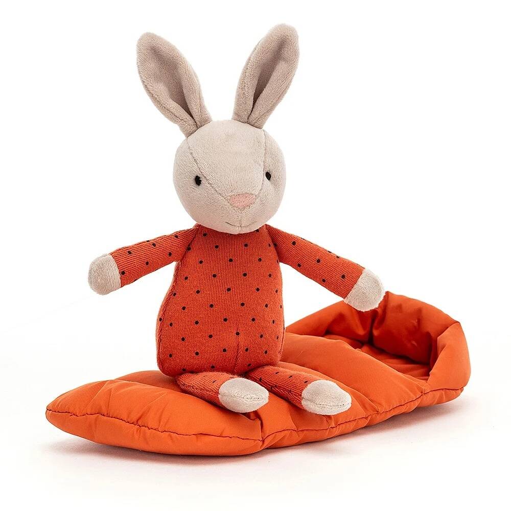snuggler bunny plush on top of orange sleeping bag