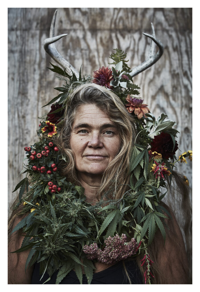 woman wearing cannabis wreath with flowers