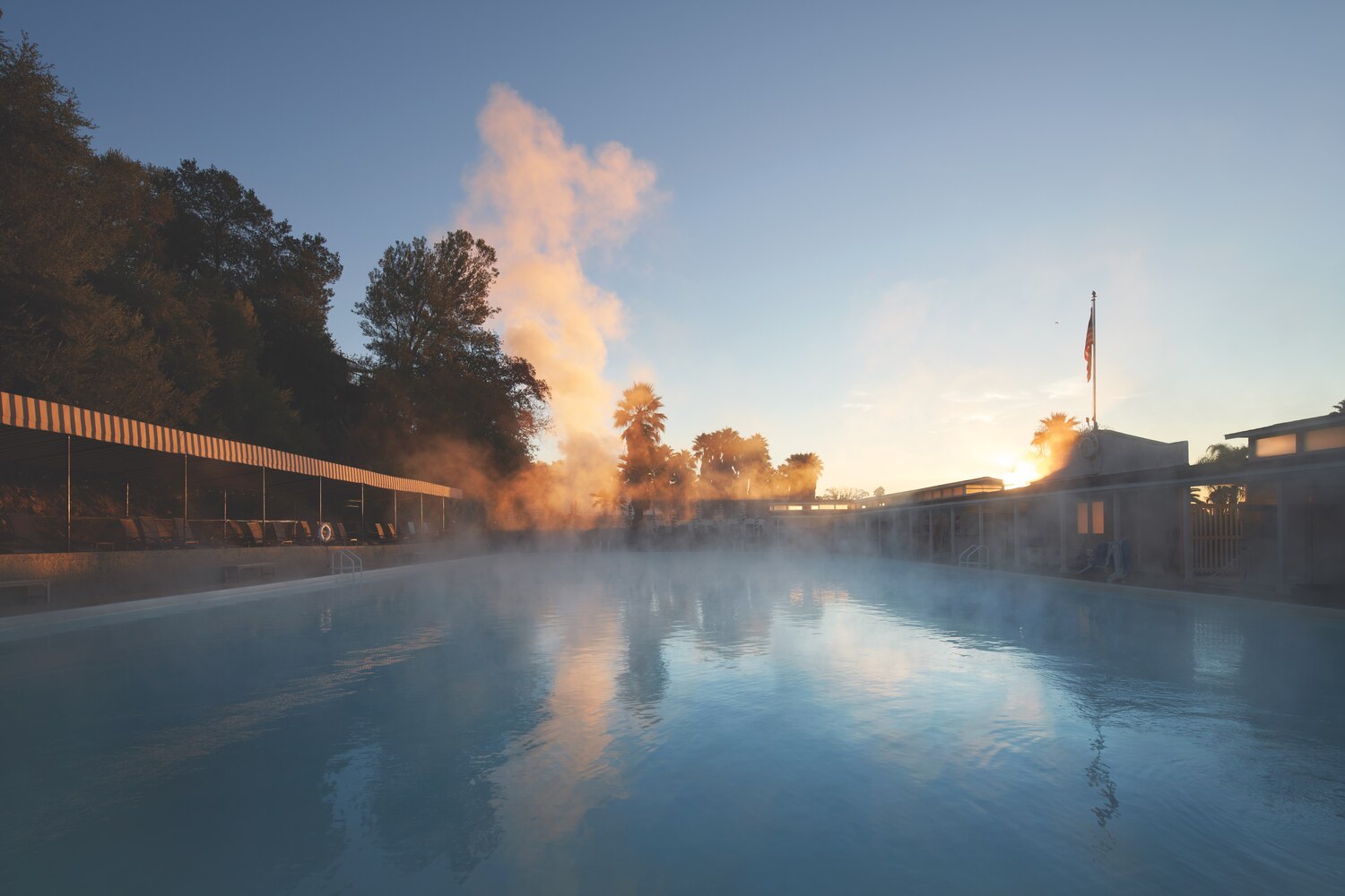 sun and steam over outdoor pool