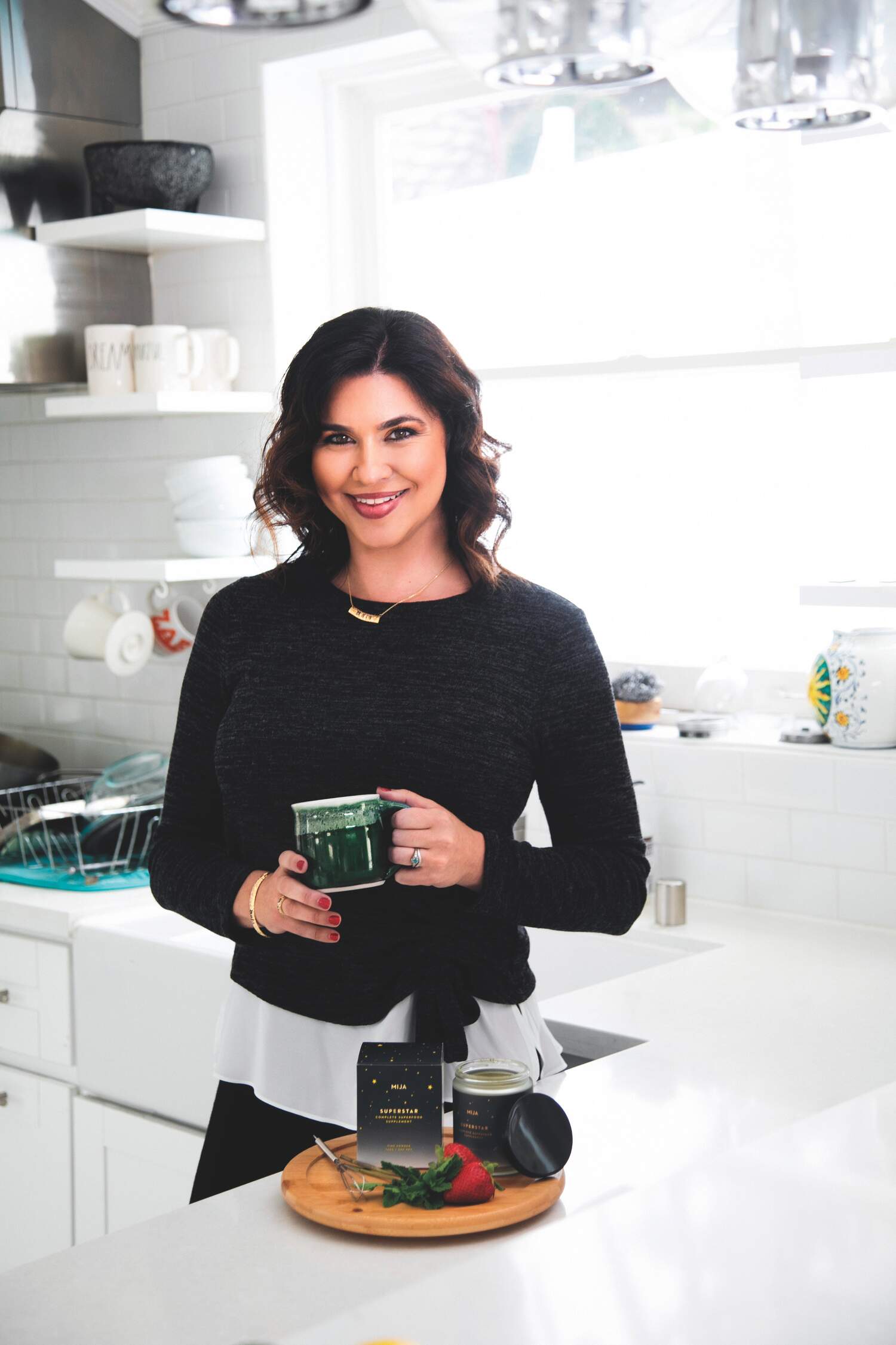 Sarah Koszyk in kitchen with green mug