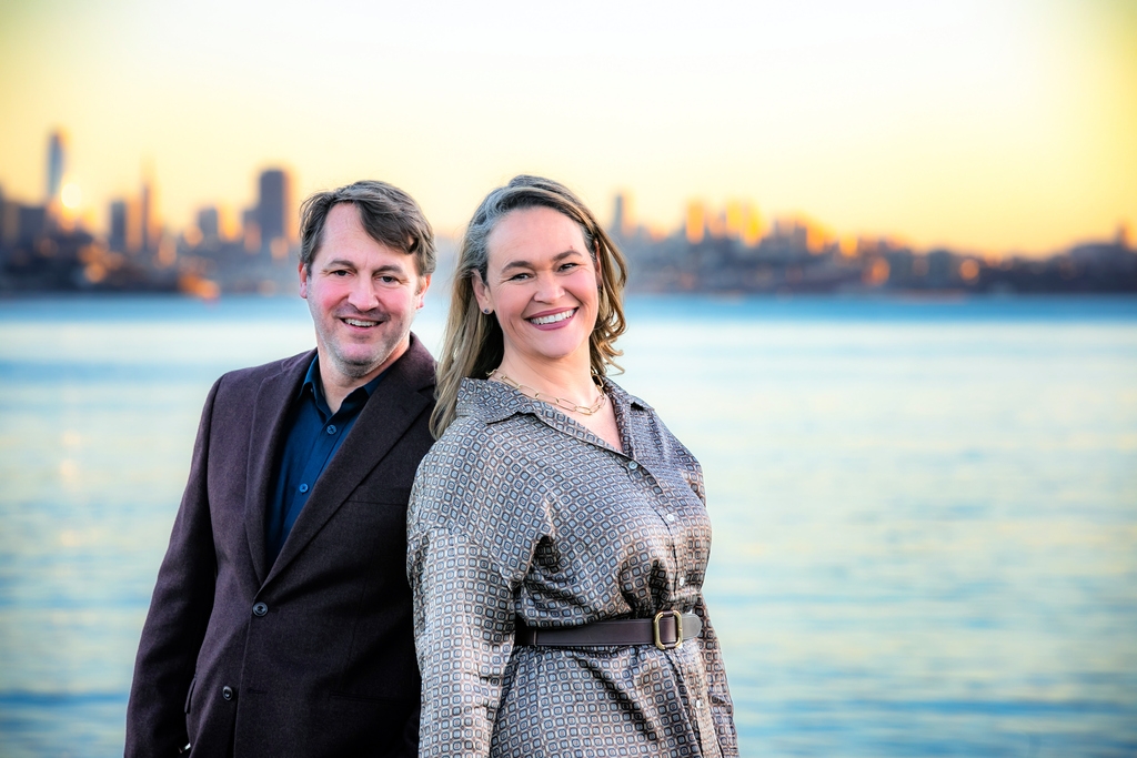elliott fink and jennifer bowman in front of the bay