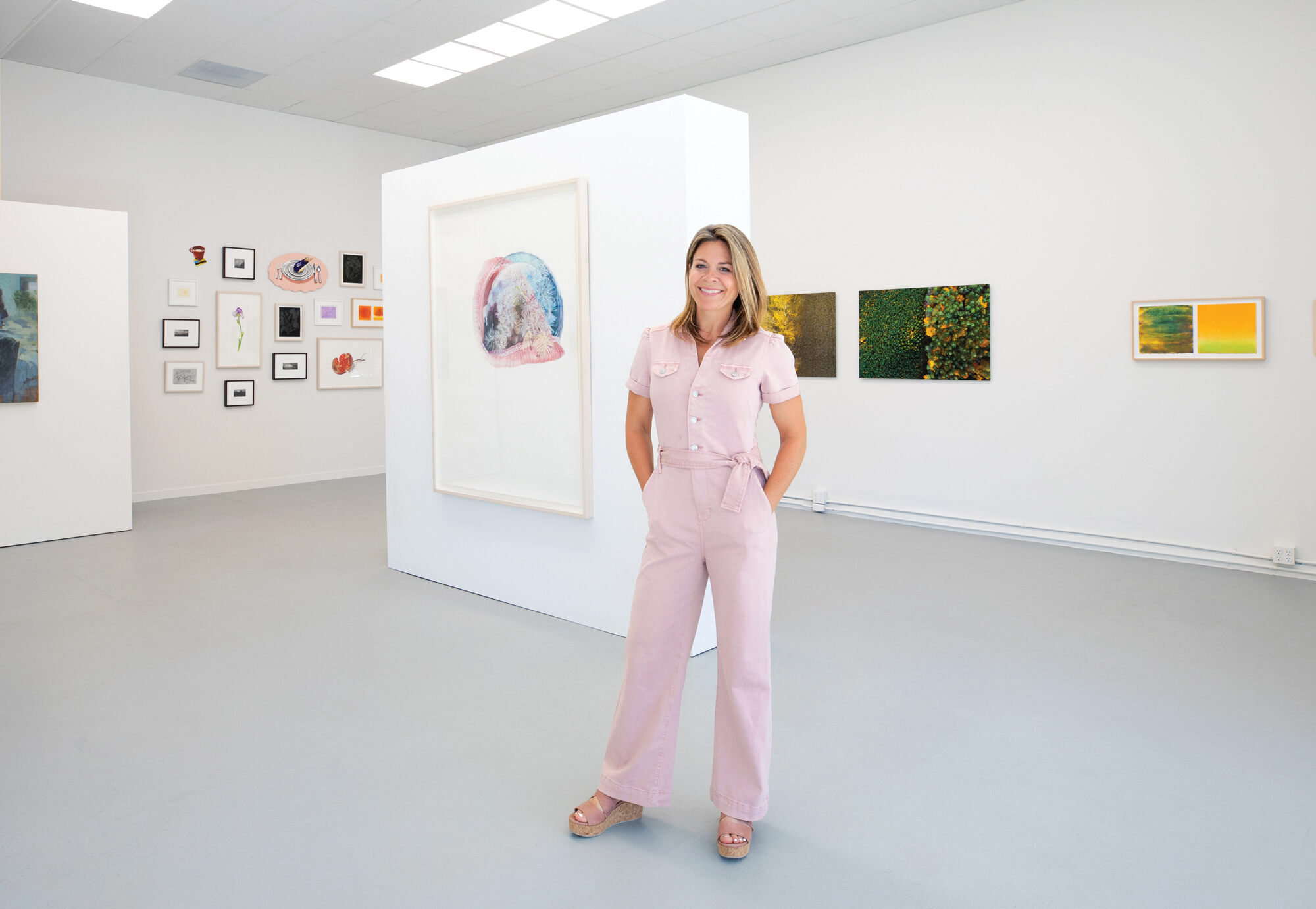 Catherine Simon standing in gallery