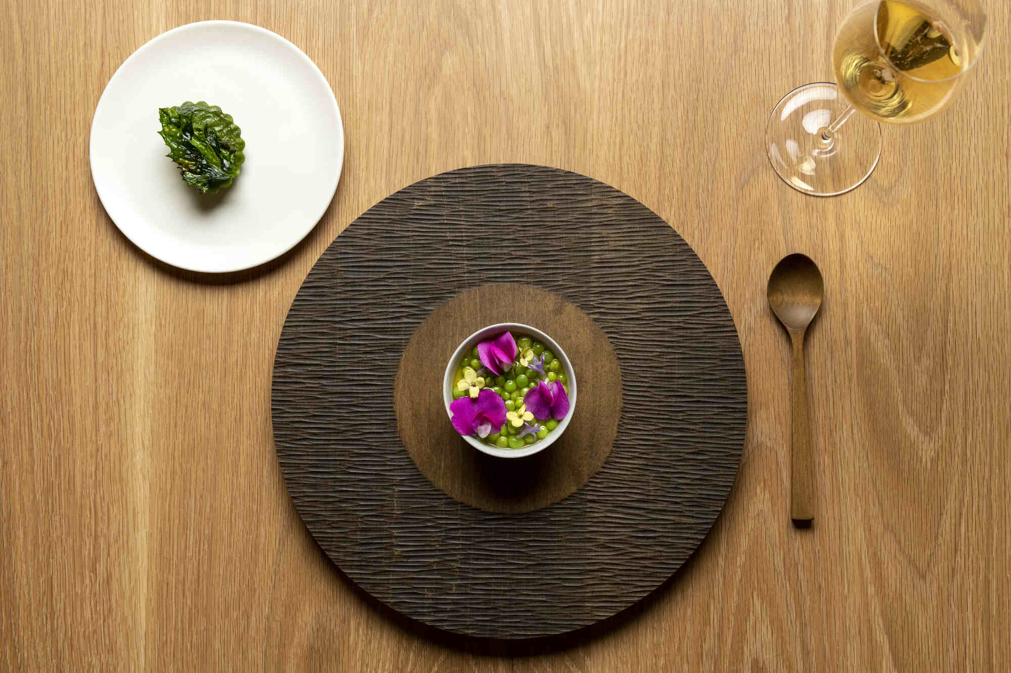 elegantly plated meal on round place setting