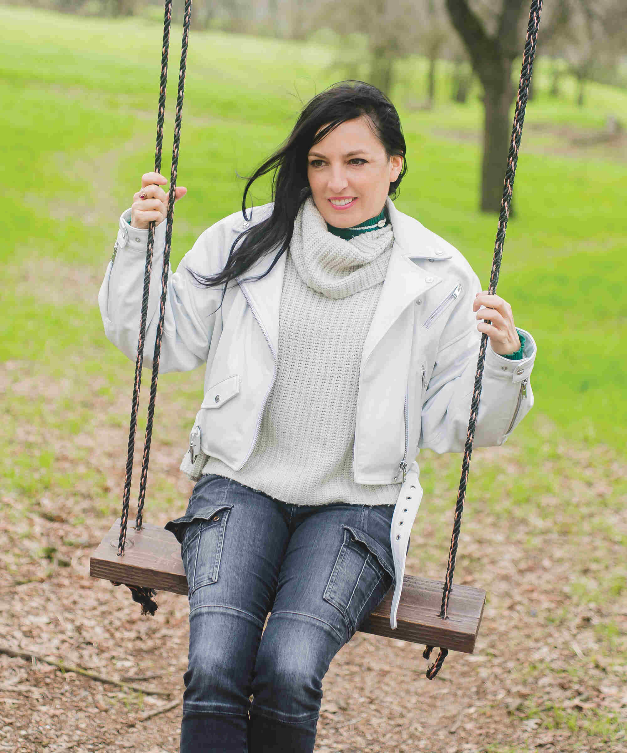 Bernadette Szilvasy sitting on a swing