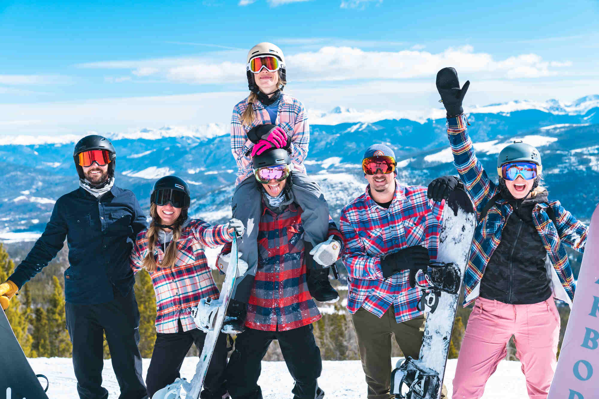 group of skiers on sunny mountaintop in California Cowboy apparel