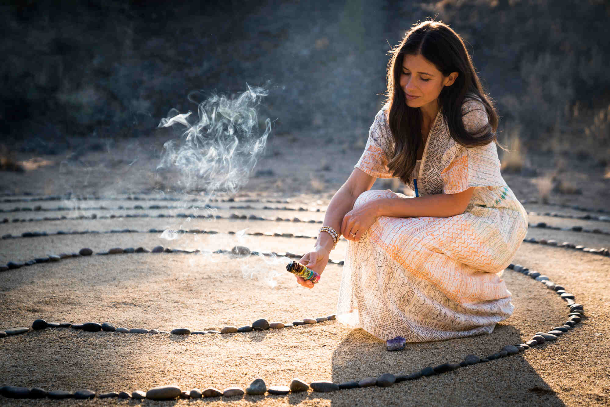 woman lighting incense outdoors