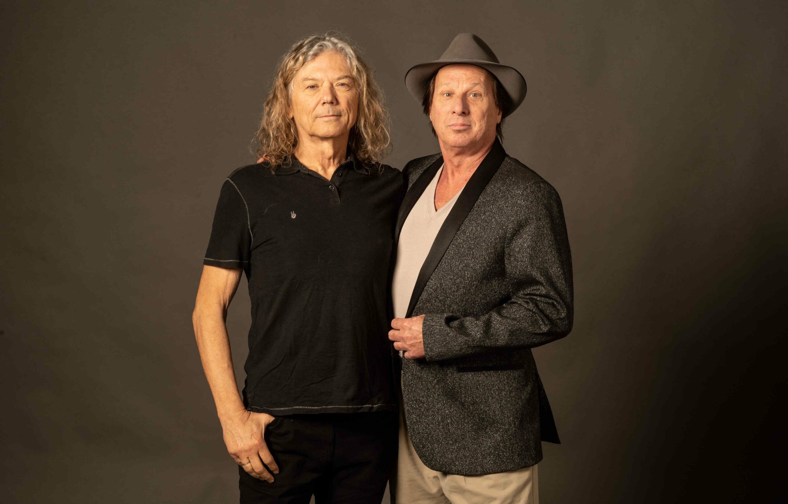 Musicians Jerry Harrison and Adrian Belew standing together