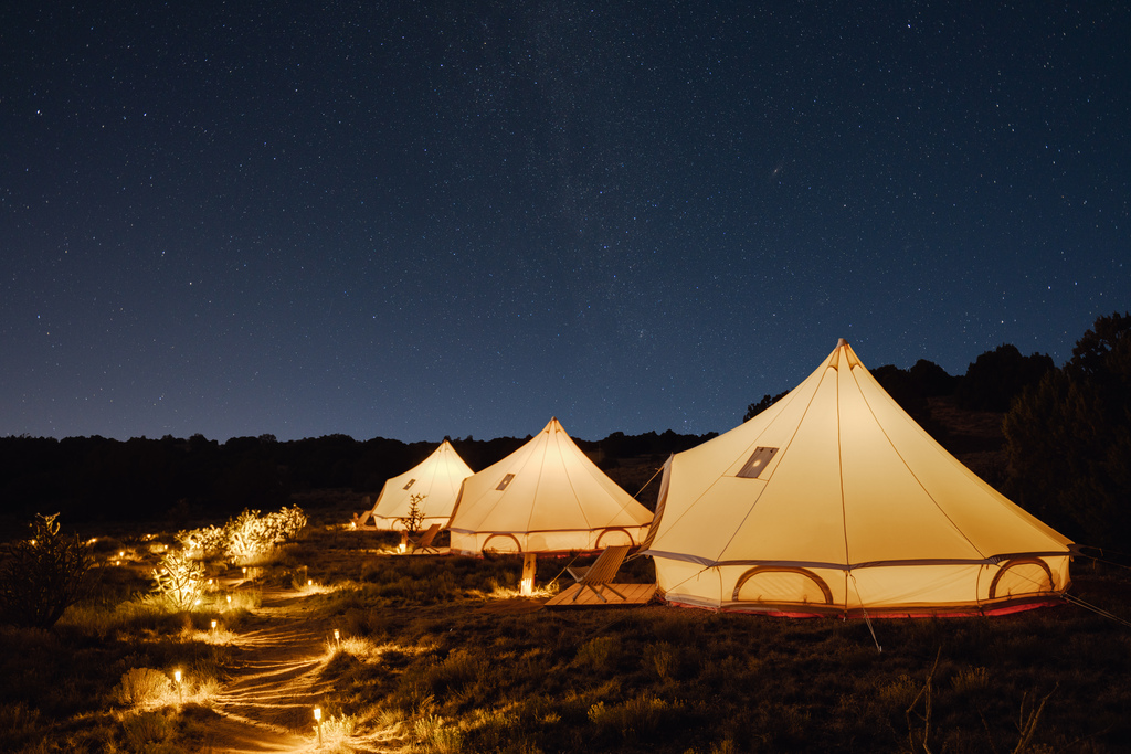 tents in a desert landscape at night