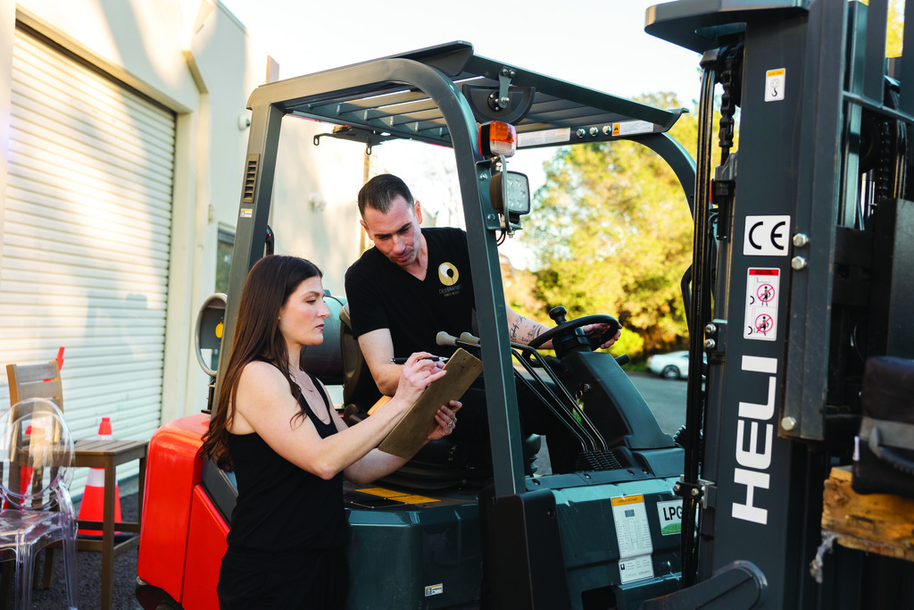 Chris and Kim Clarke with a forklift