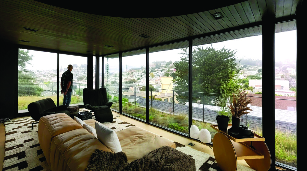 a modern home with floor to ceiling windows
