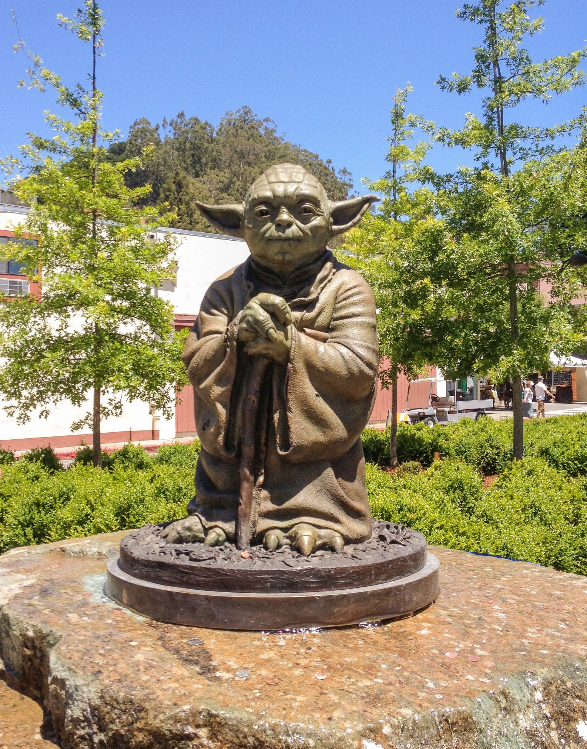a bronze statue of Yoda
