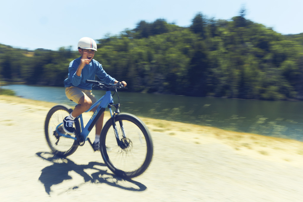 a child riding an electric bicycle
