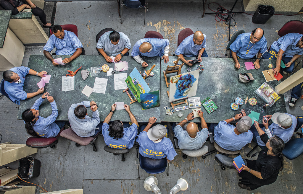 Jun Hamamoto teaches origami to a group of men who are incarcerated at San Quentin